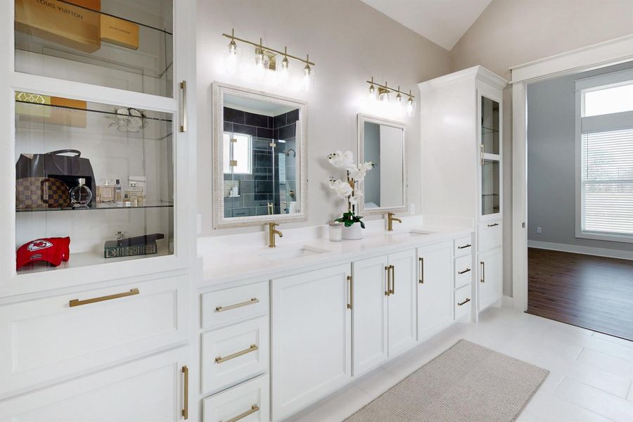 The perfect blend of elegance and fashionable grace this bathroom has chic fixtures, and clean smooth quartz surfaces which are perfect for any man or women.