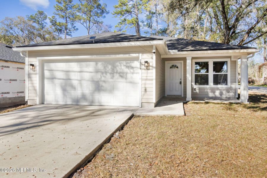 Front exterior of a new home in , Jacksonville, FL, highlighting curb appeal (Image 1). Front exterior of a new home in , Jacksonville, FL, highlighting curb appeal (Image 1).