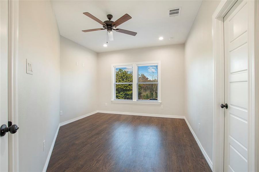 Hallway featuring dark hardwood / wood-style floors