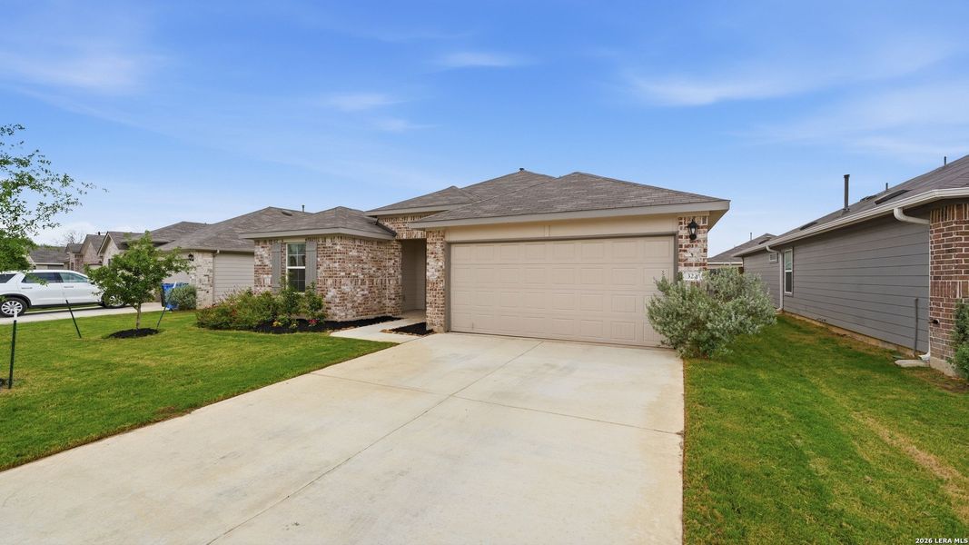 Front exterior of a new home in Heather Glen, New Braunfels, TX, highlighting curb appeal (Image 27).