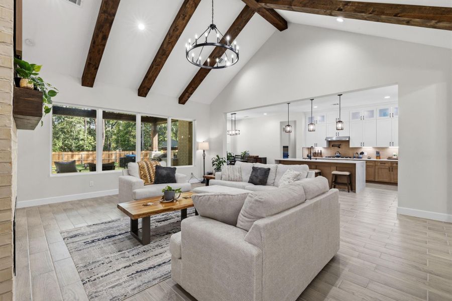 LIVING ROOM III - Living room view highlights the vaulted ceiling, abundant natural light and seamless connection to the kitchen and dining space.