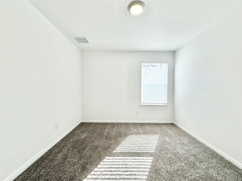 Spare room featuring baseboards and carpet Spare room featuring baseboards and carpet