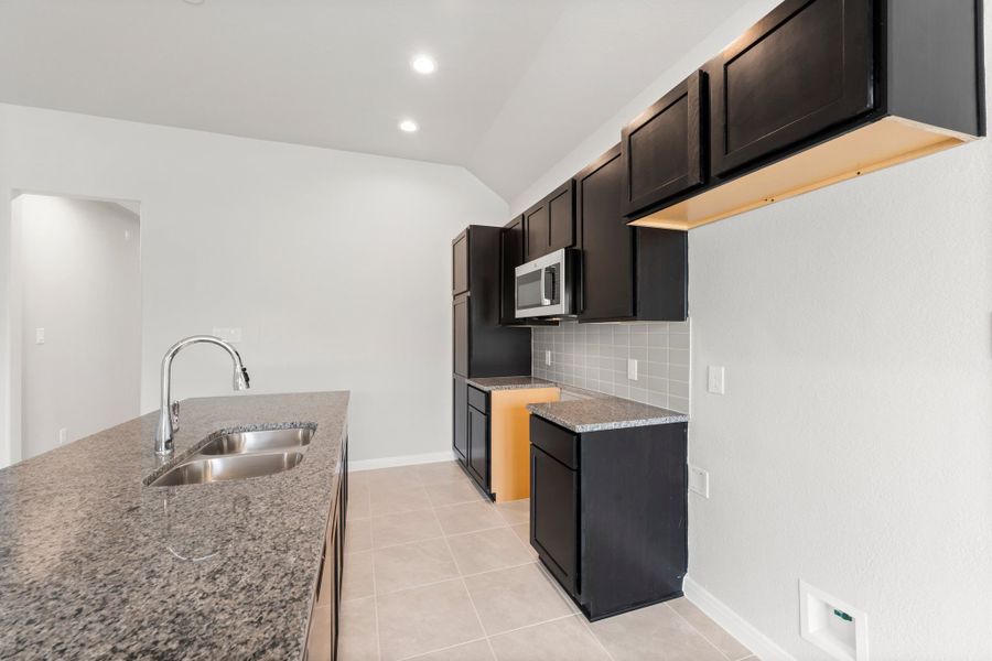Representative furnished interior of a home built from the Cambria by Alta Homes in East Gate Villas, Willis (Image 7).