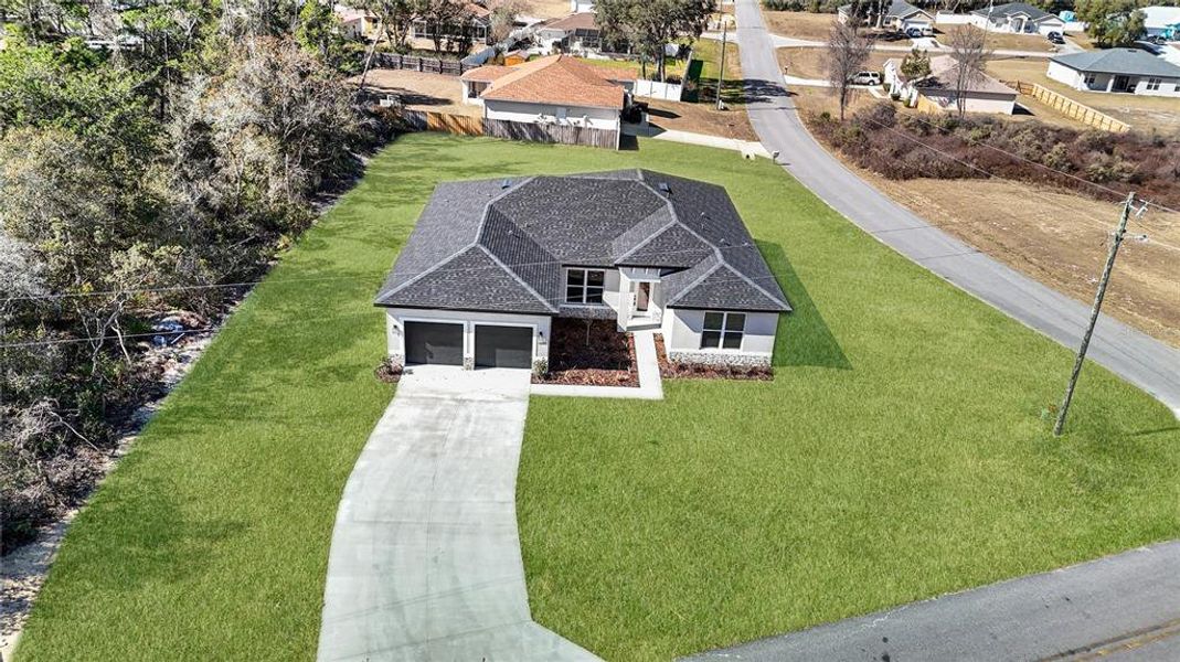 Front exterior of a new home in , Ocala, FL, highlighting curb appeal (Image 2). Front exterior of a new home in , Ocala, FL, highlighting curb appeal (Image 2).