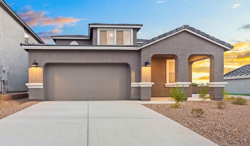 Representative exterior photo of a completed home built from the Juniper by D.R. Horton in The Oasis at Rocking K, Vail, AZ (Image 25).