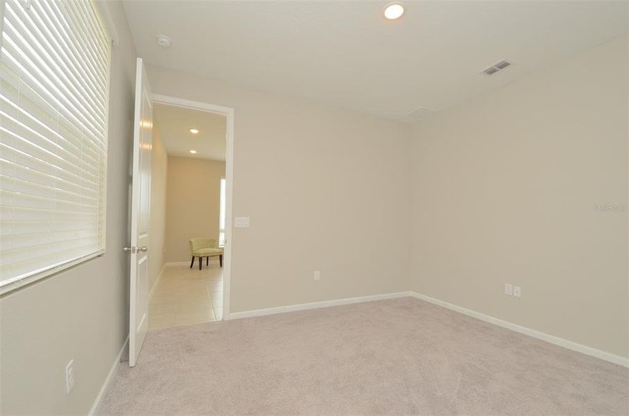 Spacious, unfurnished interior of a new home in Seasons at Eden Hills, Lake Alfred (Image 22).