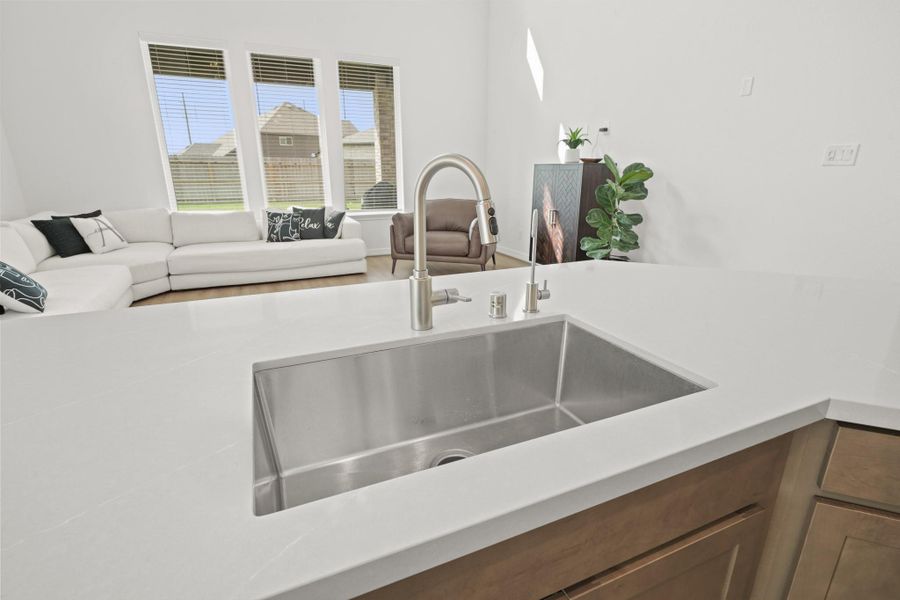 The open concept Kitchen/Living areas provide flow, functionality, and abundant natural light.