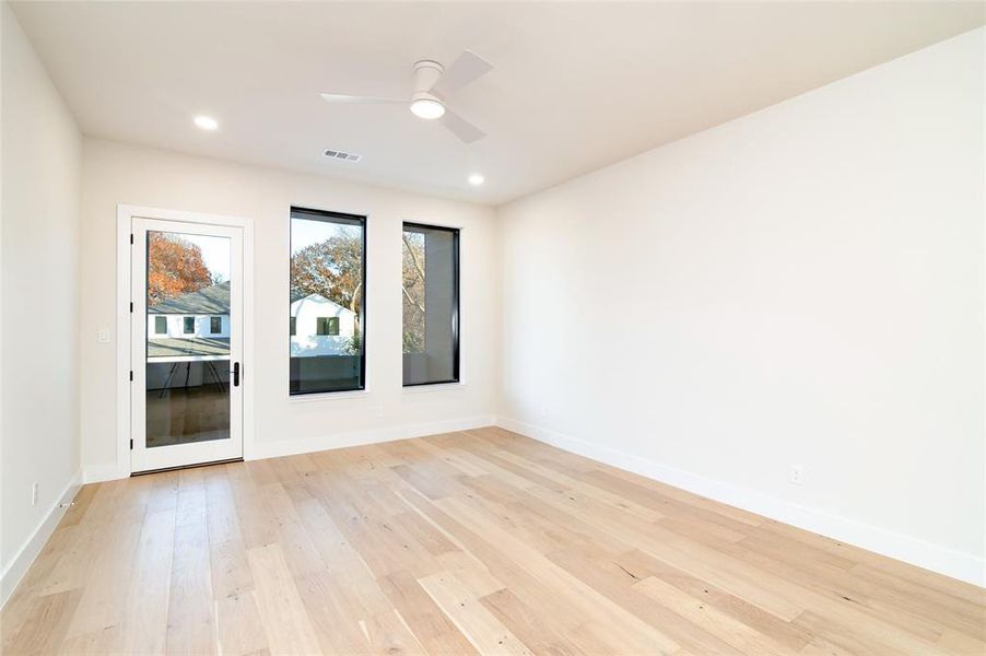 Spare room featuring ceiling fan and light hardwood / wood-style floors