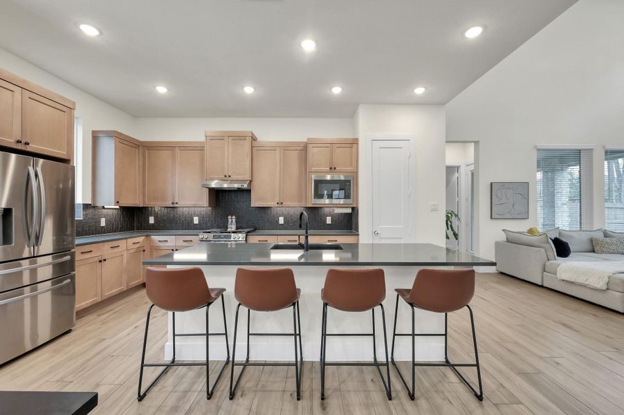 Stunning open-concept kitchen with oversized island perfect for gathering.
