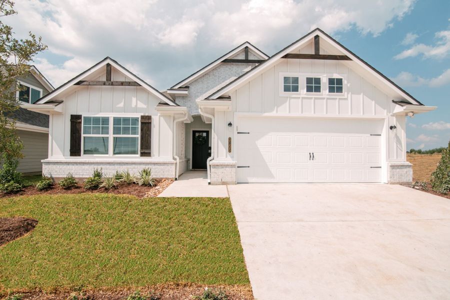 Front exterior of a new home in Rudder Pointe, Bryan, TX, highlighting curb appeal (Image 1). Front exterior of a new home in Rudder Pointe, Bryan, TX, highlighting curb appeal (Image 1).