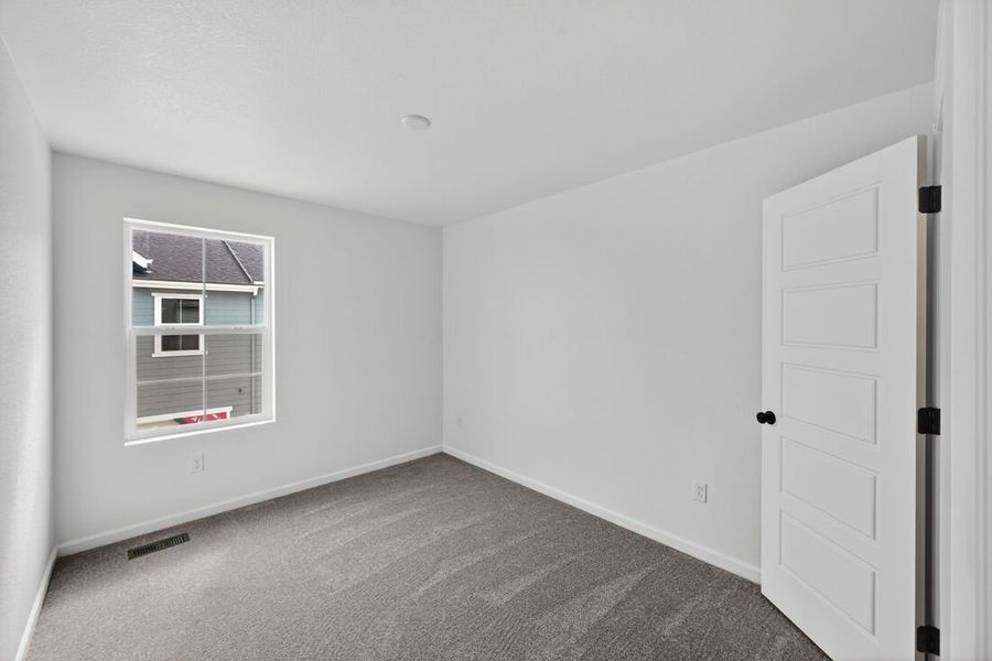 Spacious, unfurnished interior of a new home in Trailstone, Arvada (Image 22).
