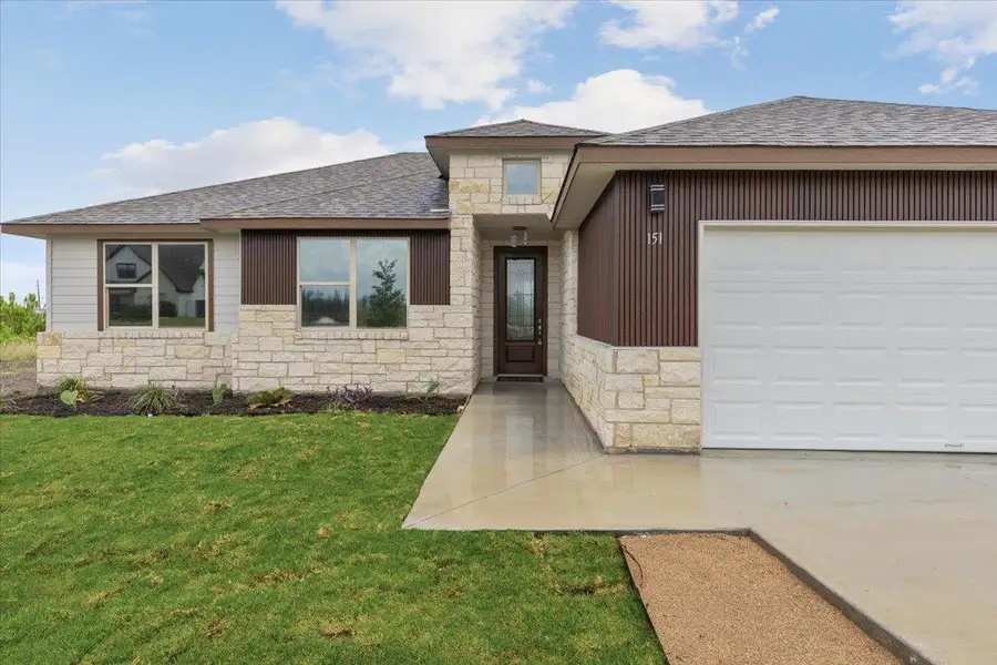 A striking facade with varied textures and modern accents creates an inviting curb appeal. A striking facade with varied textures and modern accents creates an inviting curb appeal.