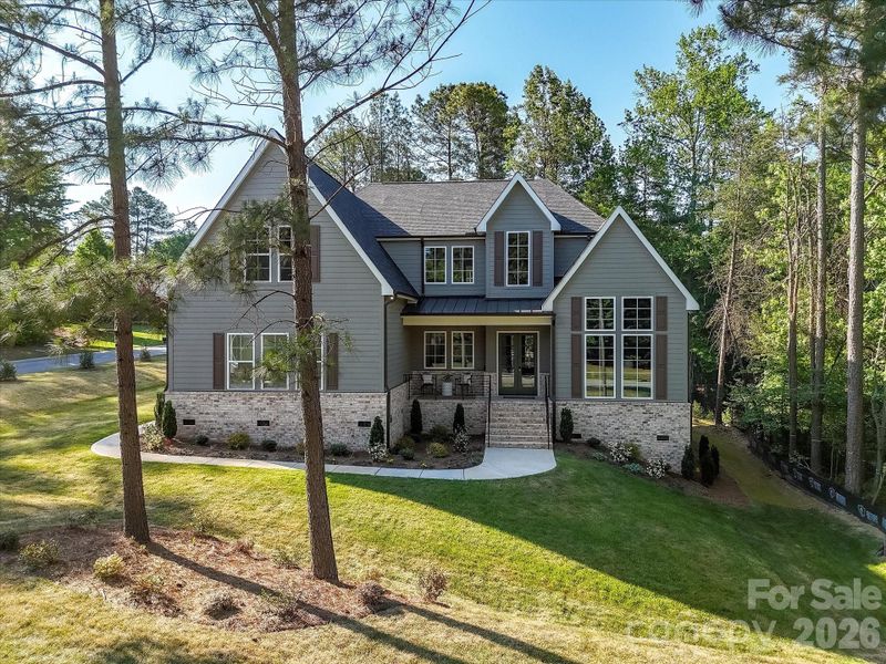 Stunning craftsman-style home with charming covered front porch, stone accents, and nestled on a private, wooded lot offering both curb appeal and peaceful surroundings. Stunning craftsman-style home with charming covered front porch, stone accents, and nestled on a private, wooded lot offering both curb appeal and peaceful surroundings.