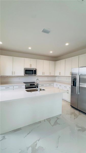Furnished interior view inside a new home in , Homestead (Image 11). Furnished interior view inside a new home in , Homestead (Image 11).