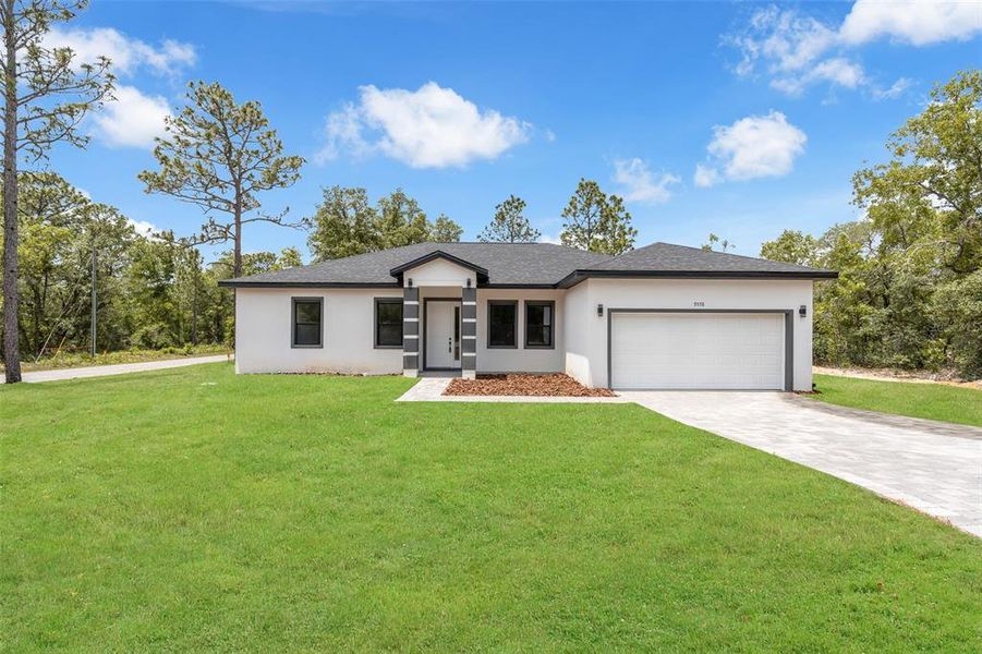 Front exterior of a new home in , Citrus Springs, FL, highlighting curb appeal (Image 23).