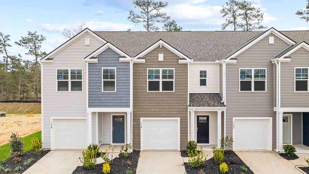 Front exterior of a new home in Marion Village, Santee, SC, highlighting curb appeal (Image 2). Front exterior of a new home in Marion Village, Santee, SC, highlighting curb appeal (Image 2).