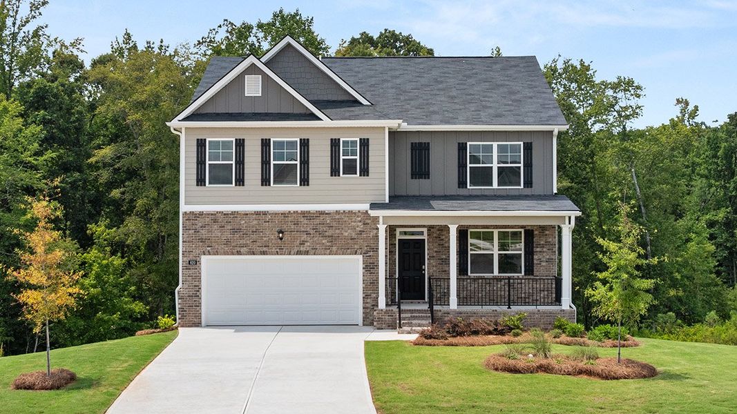 Front exterior of a new home in Locust Grove Station - Cedar Ridge, Locust Grove, GA, highlighting curb appeal (Image 1). Front exterior of a new home in Locust Grove Station - Cedar Ridge, Locust Grove, GA, highlighting curb appeal (Image 1).