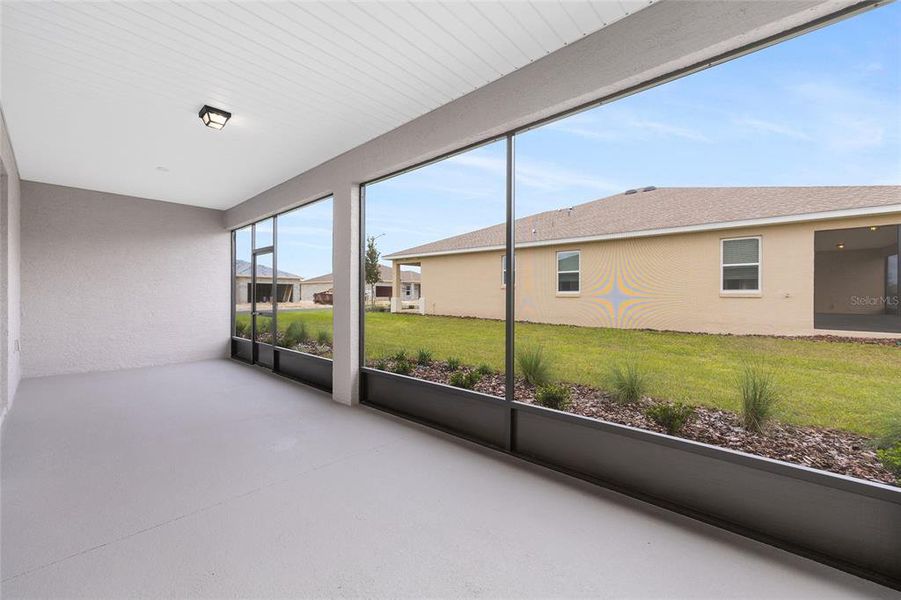 Exterior details and patio area of a home in On Top of the World Communities, Ocala (Image 3).