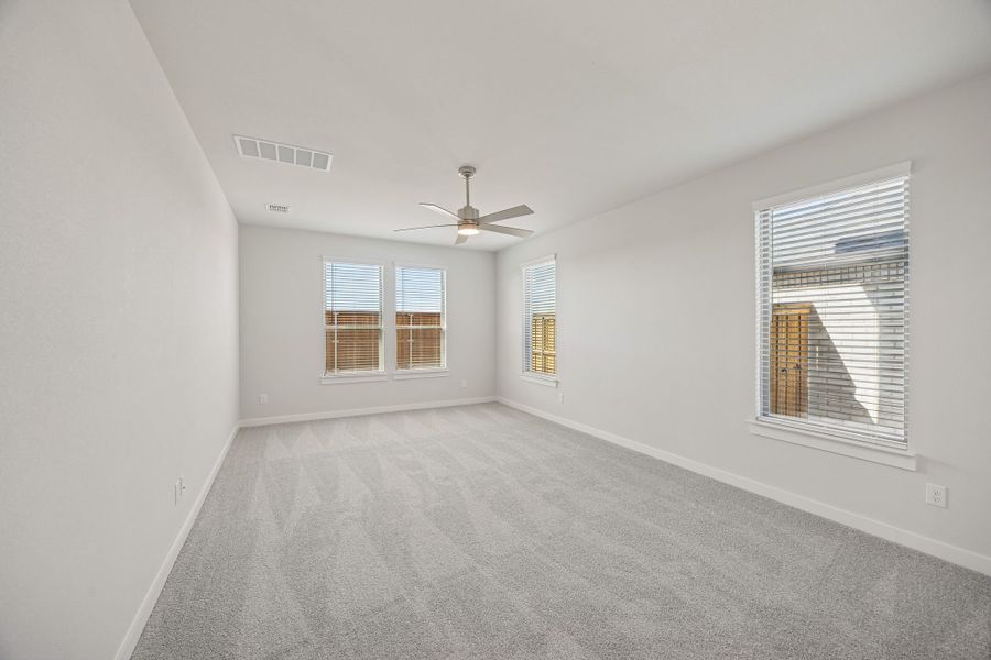 Primary Suite in the Wimbledon home plan by Trophy Signature Homes – REPRESENTATIVE PHOTO