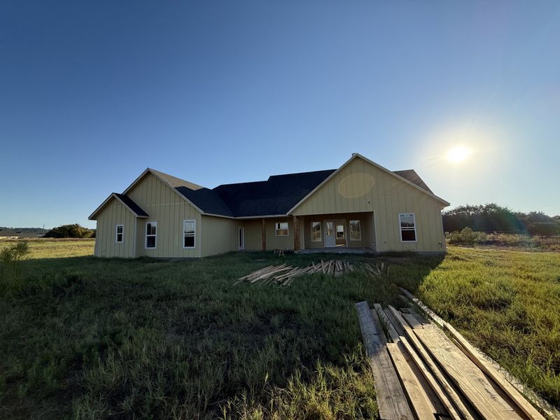 Front exterior of a new home in Oak Water Ranch, Granbury, TX, highlighting curb appeal (Image 5).