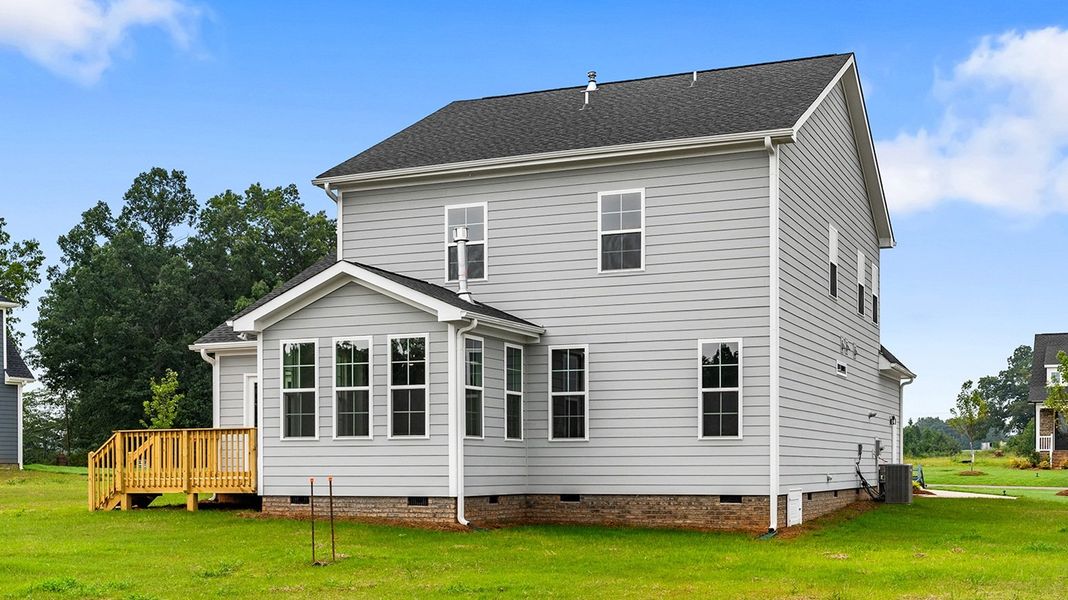 Front exterior of a new home in Lilah Grove, Summerfield, NC, highlighting curb appeal (Image 28).