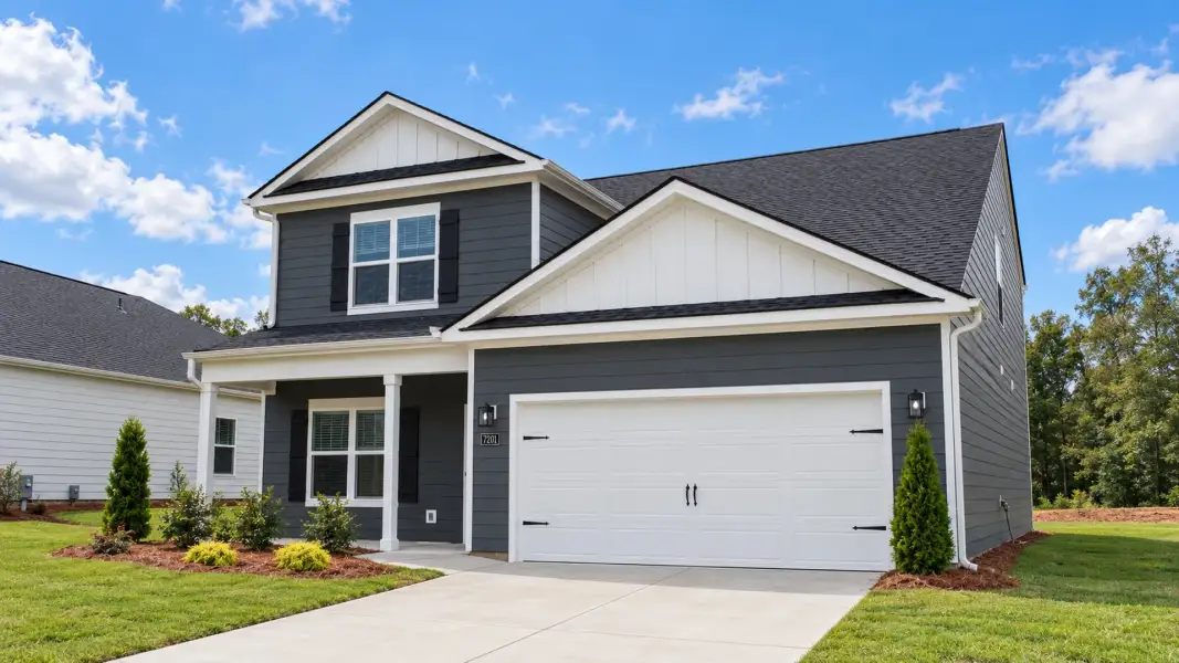 Front exterior of a new home in The Hideaway at Edgestone, Ooltewah, TN, highlighting curb appeal (Image 2). Front exterior of a new home in The Hideaway at Edgestone, Ooltewah, TN, highlighting curb appeal (Image 2).