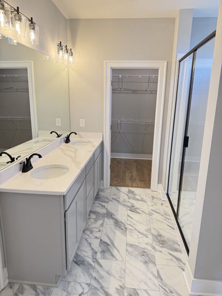 Primary bathroom with large walk in closet Primary bathroom with large walk in closet