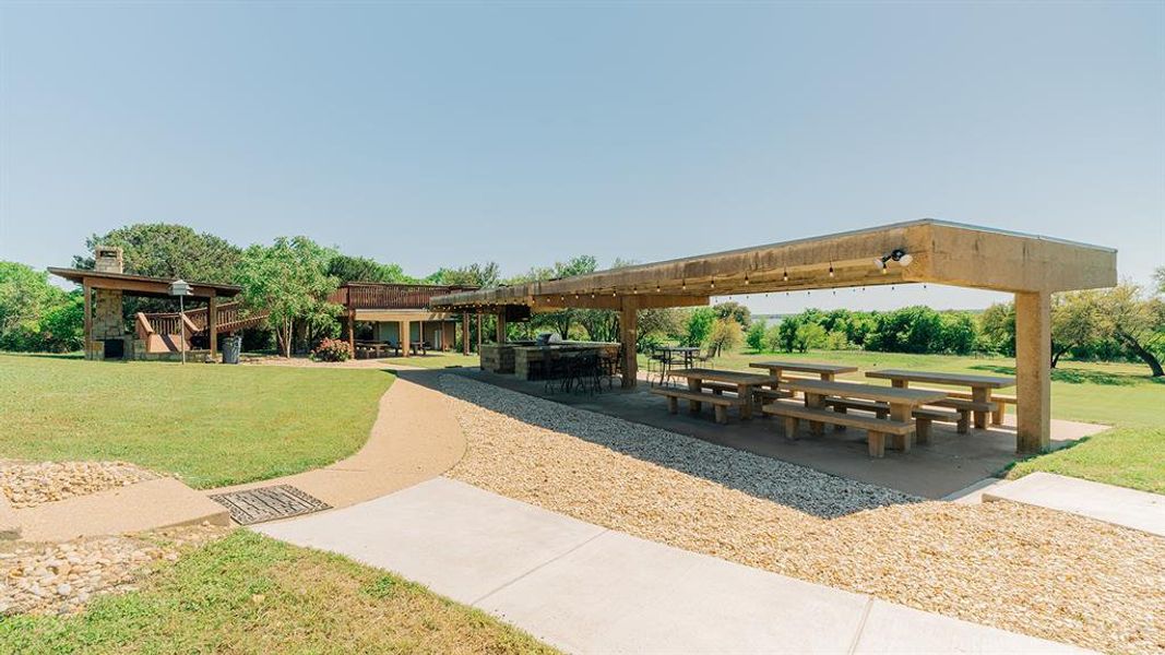 View of community featuring a patio area and a yard