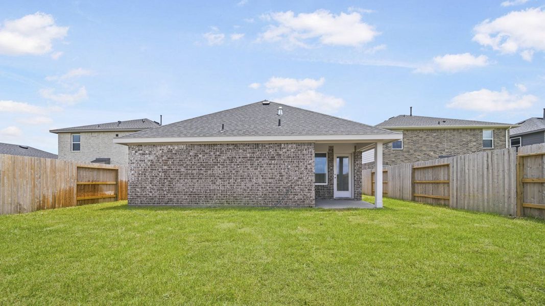 Exterior details and patio area of a home in Sunterra, Katy (Image 4).