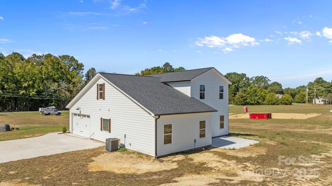 Front exterior of a new home in , Monroe, NC, highlighting curb appeal (Image 1).
