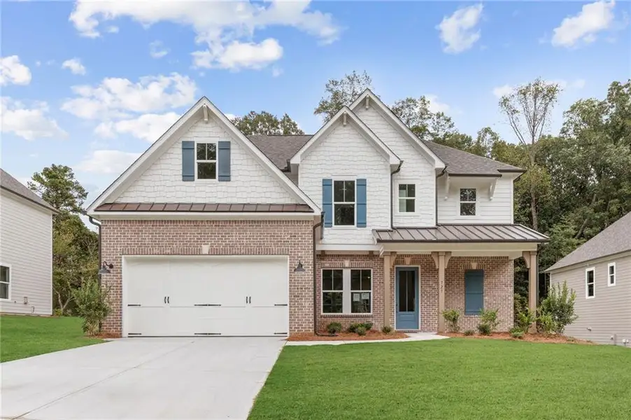 Front exterior of a home in the Ashbury Commons community, located in Powder Springs, GA (Image 2).