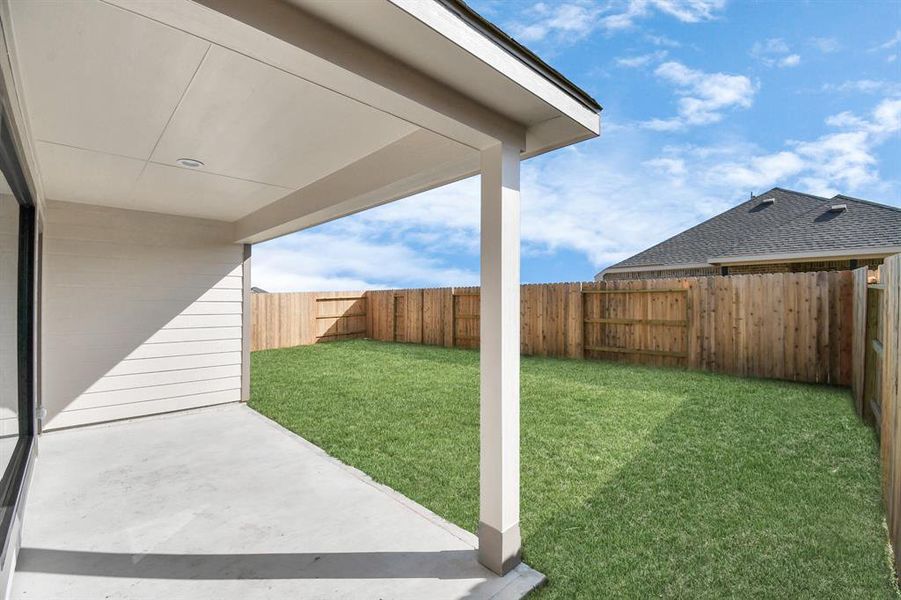 Experience outdoor living at its finest on this expansive covered patio,thoughtfully designed for BBQs and delightful outdoor dining! Sample photo of completed home with similar floor plan. Actual colors and selections may vary.