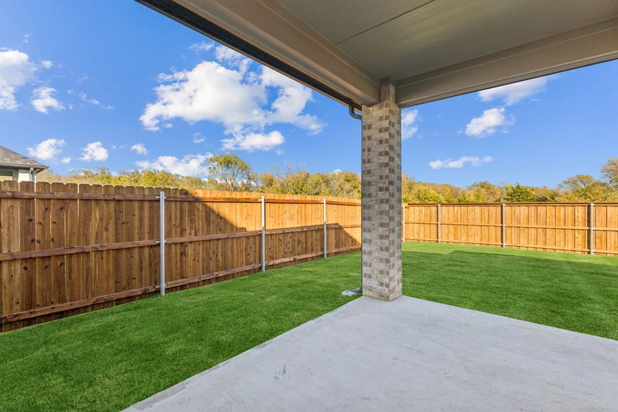 Covered Patio in the Wimbledon home plan by Trophy Signature Homes – REPRESENTATIVE PHOTO