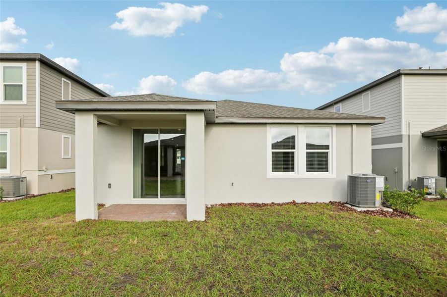 Exterior details and patio area of a home in Springs at Lake Alfred - Classic Series, Lake Alfred (Image 3).