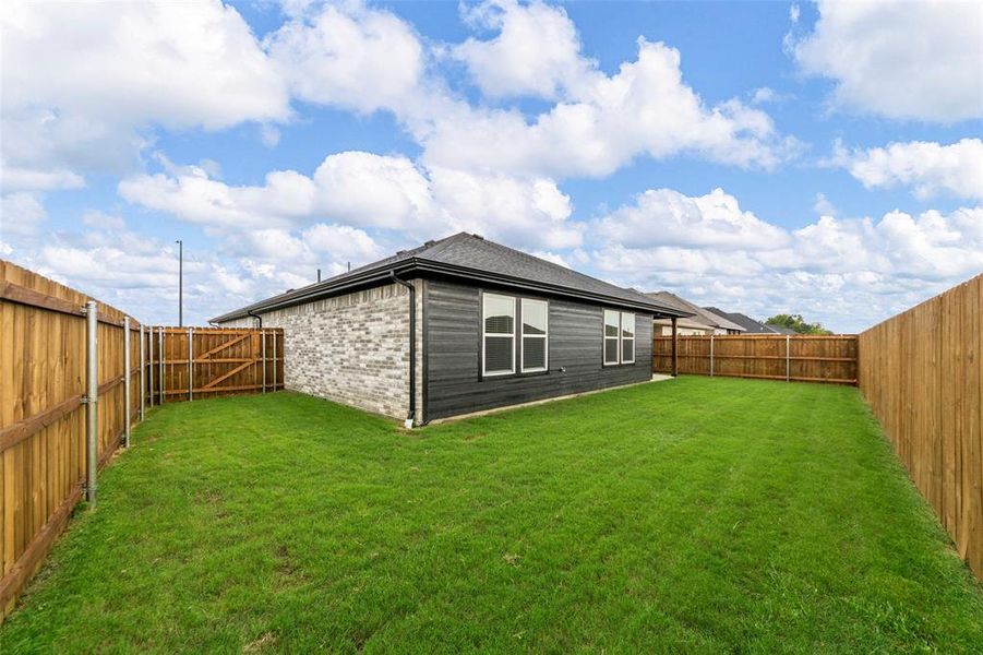 Front exterior of a new home in , Greenville, TX, highlighting curb appeal (Image 19). Front exterior of a new home in , Greenville, TX, highlighting curb appeal (Image 19).