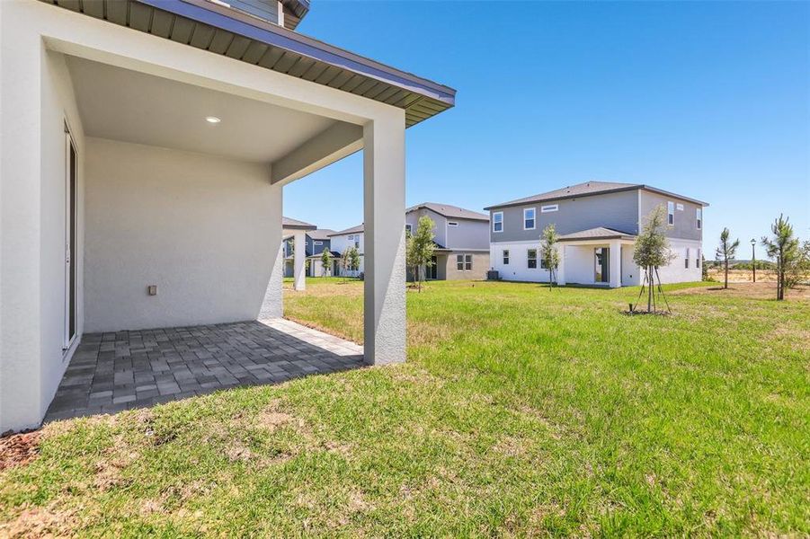 Exterior details and patio area of a home in Cyrene at Minneola - Villas, Montverde (Image 4).