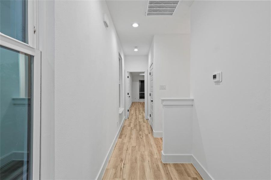 Hallway featuring light hardwood / wood-style floors