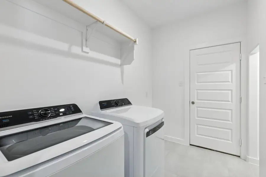 Utility Room in the Holden home plan by Trophy Signature Homes – REPRESENTATIVE PHOTO