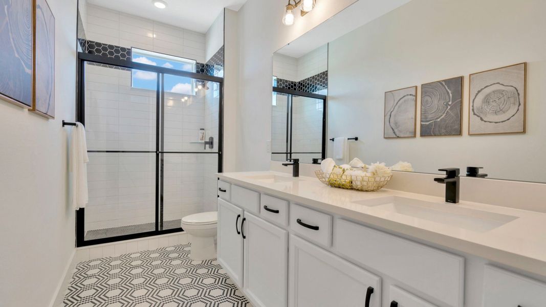The Fourth Bathroom of a DRB Homes Grand Eider model, which is a home plan offered at Serengeti in Spring Hill, FL.