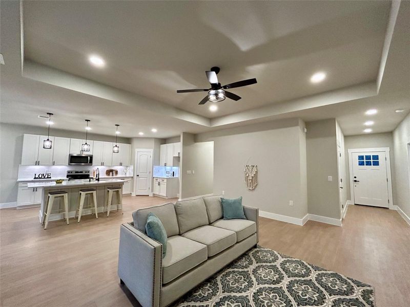 Open concept living, dining, and kitchen areas.