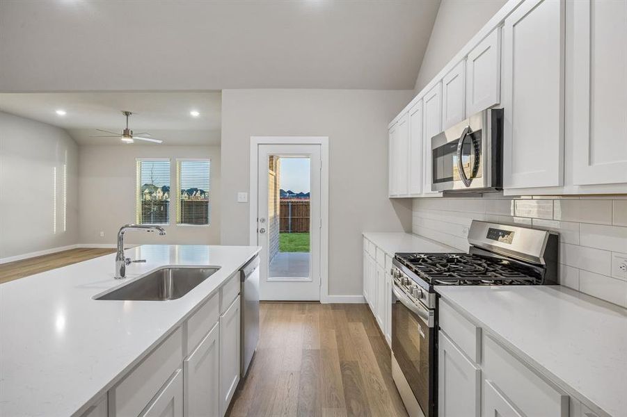 Kitchen in the Wimbledon home plan by Trophy Signature Homes – REPRESENTATIVE PHOTO Kitchen in the Wimbledon home plan by Trophy Signature Homes – REPRESENTATIVE PHOTO