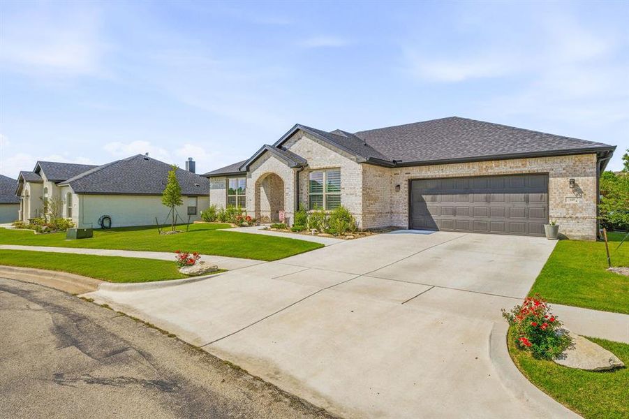 Front exterior of a new home in , Glen Rose, TX, highlighting curb appeal (Image 2). Front exterior of a new home in , Glen Rose, TX, highlighting curb appeal (Image 2).