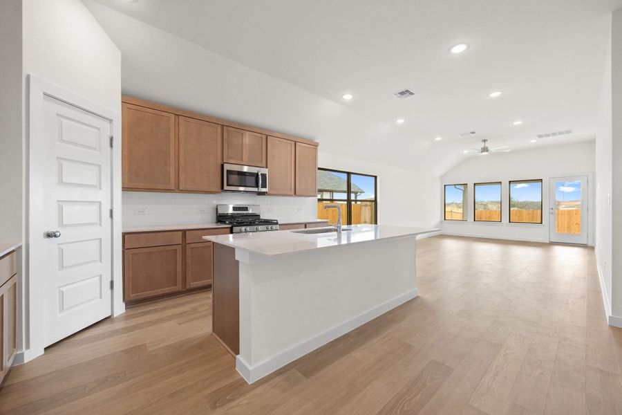 Kitchen in the Turquoise home plan by Trophy Signature Homes – REPRESENTATIVE PHOTO
