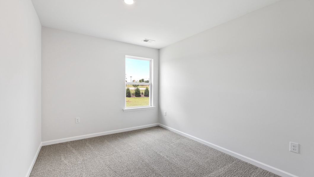 Spacious, unfurnished interior of a new home in Tanglewood Townes, Greenville (Image 21).