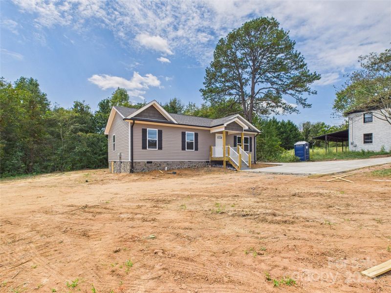 Front exterior of a new home in , Connelly Springs, NC, highlighting curb appeal (Image 18). Front exterior of a new home in , Connelly Springs, NC, highlighting curb appeal (Image 18).
