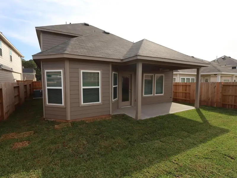 Exterior details and patio area of a home in Lone Star Landing, Montgomery (Image 3). Exterior details and patio area of a home in Lone Star Landing, Montgomery (Image 3).