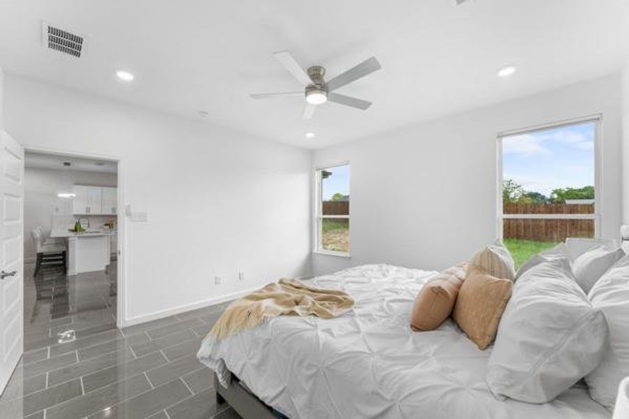Bedroom with recessed lighting and a ceiling fan Bedroom with recessed lighting and a ceiling fan