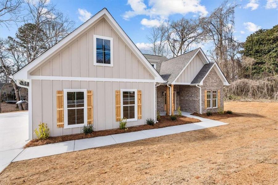 Front exterior of a new home in , Temple, GA, highlighting curb appeal (Image 20).