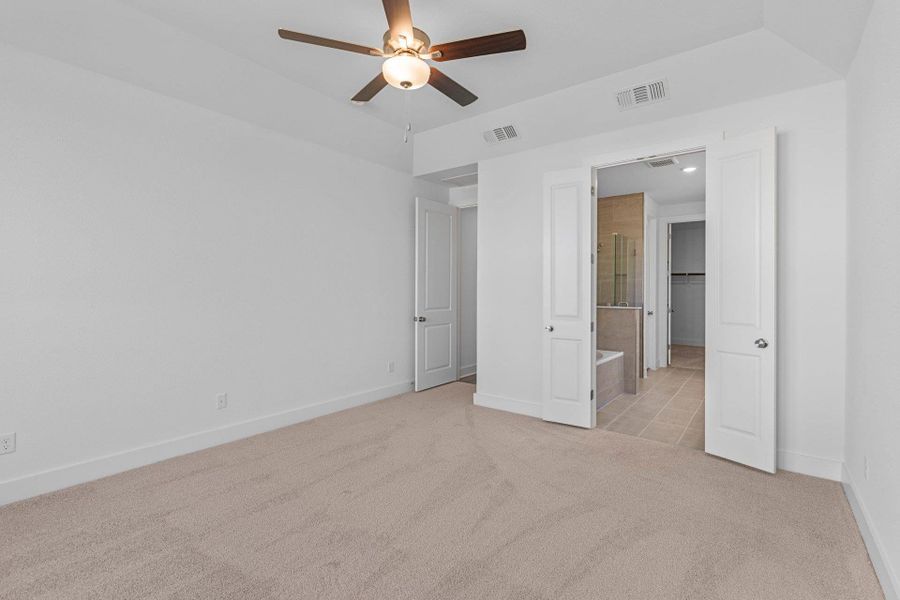 Primary Bedroom with elevated ceiling