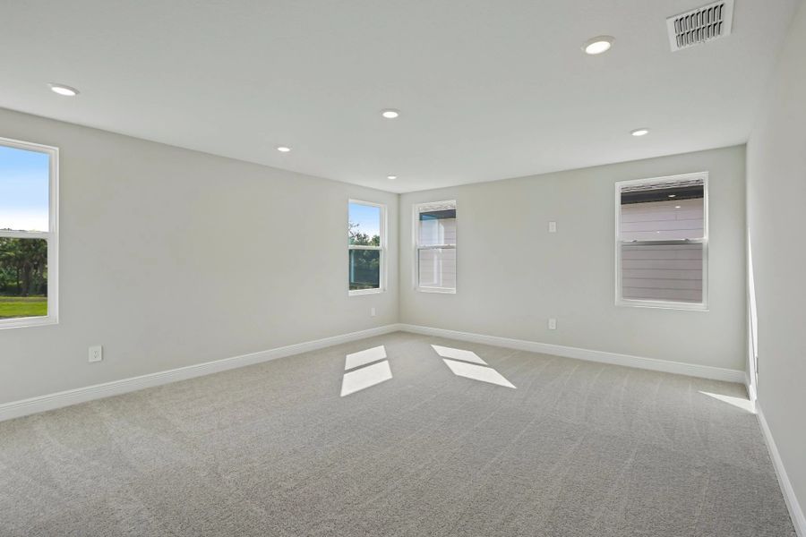 Off the bonus room is a spacious media room
